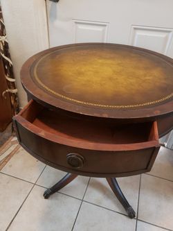 Antique leather top table.