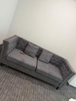 Gray Tufted Sofa with Nailhead Trim
