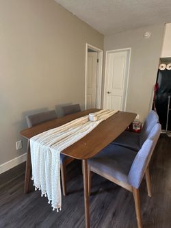 Modern dining table with 4 upholstered chairs
