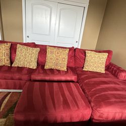 Red sectional With Queen sofa bed and ottoman 