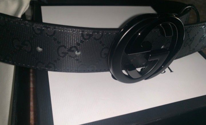 Black leather gucci belt with tags and code