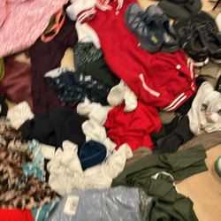 A Lot Of Different Sizes Of Clothes And Shoes, Snickers For Men , Women, And Children , Some Of The Items Are New And Of Good Quality