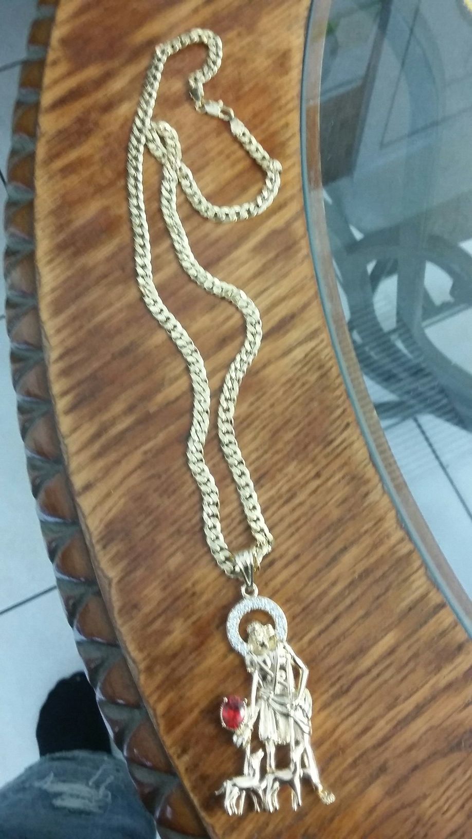 Very nice 14kt gold over stainless steel 26inch Cuban link Chain with nice San Lazaro charm for sale !!