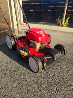 Troy-Bilt TB230 21-in self-propelled gas lawn mower.