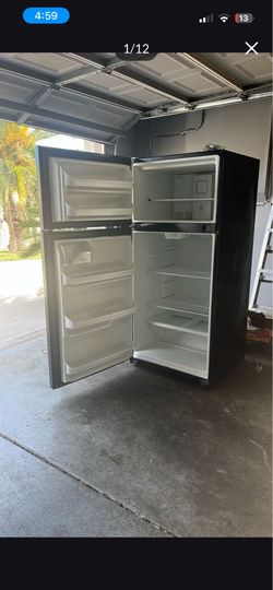 65- inch Frigidaire 2- door refrigerator top freezer and adjustable shelves