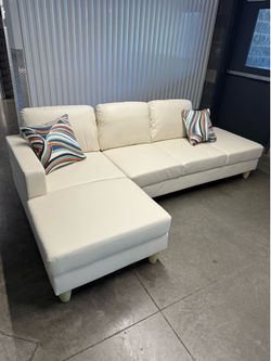 New Faux Leather sectional 2 pieces- Delivery Available