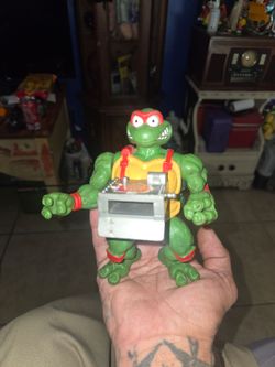 vintage 1993 Pizza Tossin' Raphael action figure by Playmates Toys from the Teenage Mutant Ninja Turtles (TMNT) series