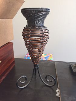 Black and brown metal and wicker candle holder