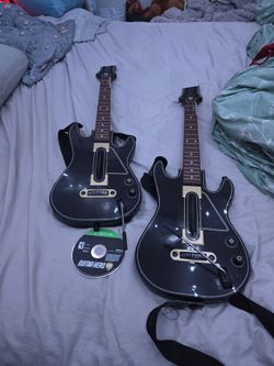 Guitar hero cd and 2 guitars without dongles
