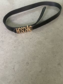 Black belt with gold letter writing
