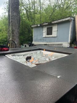 Propane fire pit 40,000 btu with clear glass stones. Beautiful for any patio or porch