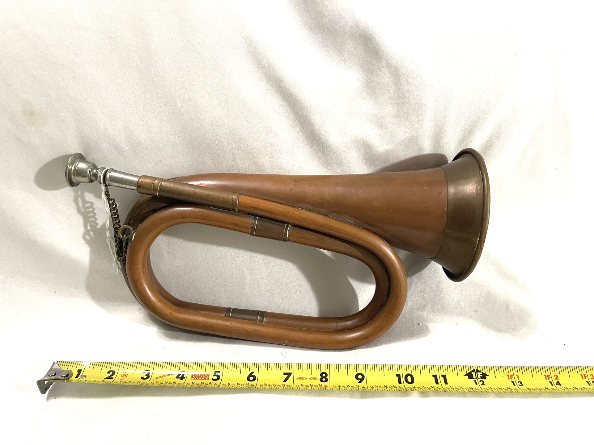 Antique 1901 Military Copper & Brass Bugle. Complete With Mouthpiece. Fine Condition Rare Find. It is valued at $150.