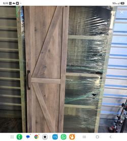 Farmhouse cabinet with sliding door.