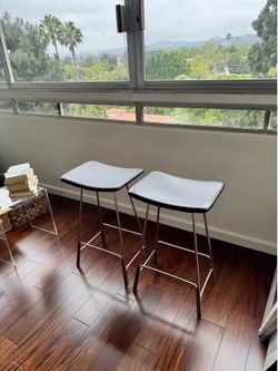 Two Nuevo Brand Leather Stools