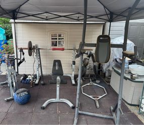 Olympic weights bars and other workout equipment. There were outdoors so equipment has rust but there all in solid working condition . Selling everyth
