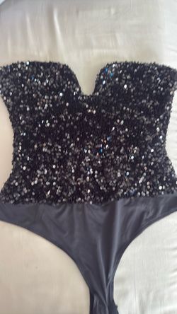Glittery black body suit