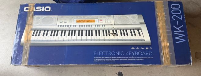 Casio WK-200 76-Key Electronic Keyboard w/ Stand, Adapter, Music Rest & Songbook – Like New in Box