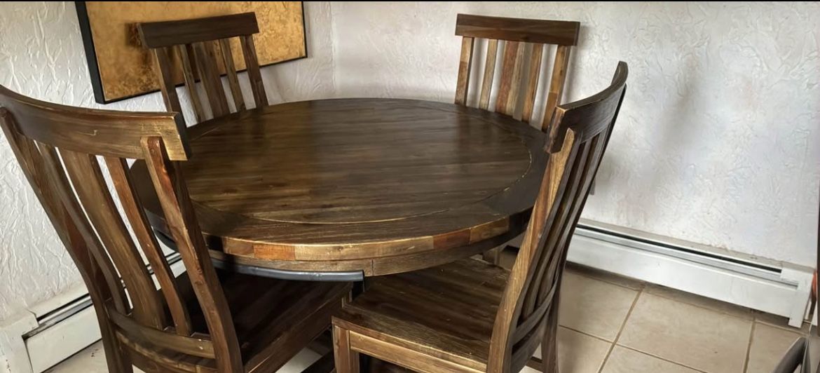 Round rustic dining table with chairs