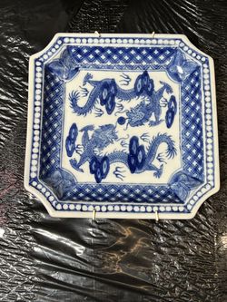 vintage Chinese blue and white porcelain square plate decorated with a dragon motif.