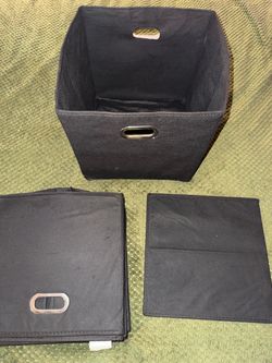 Four black 12x12 collapsible cube organizers