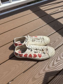white cdg low top cons