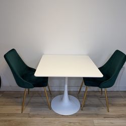 Modern White Table With Green Chairs 
