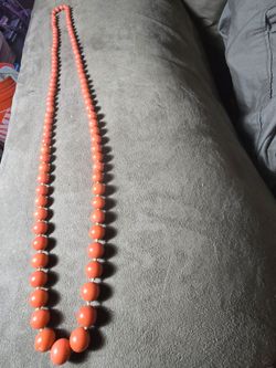 Vintage Single-Strand Natural Red Coral Bead NecklaceBeautiful, classic opera-length strand of genuine, natural red coral beads. This is authentic, un