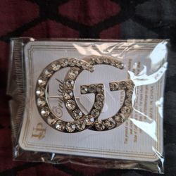 A GG Brooch Or Pin For Clothes Or Jackets