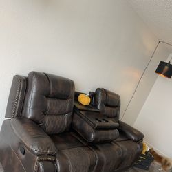 Brown Leather Couch With Two End Recliners, Middle Charging Deck With Two Cupholders Wooden Coffee Table