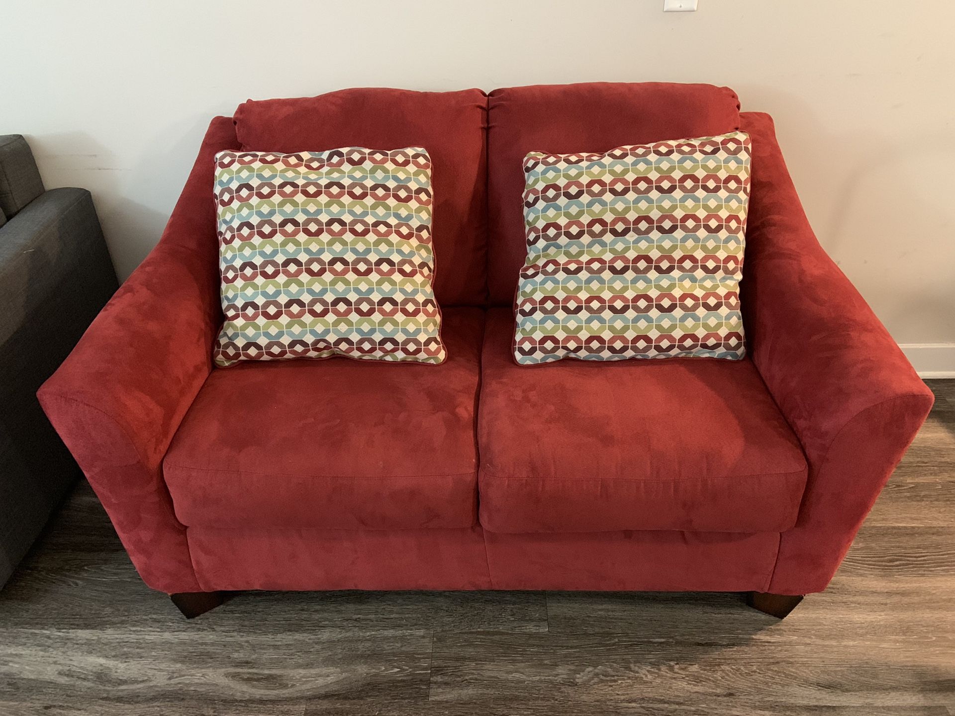 2 seater couch with pillows