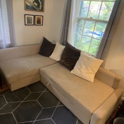 Sectional couch (beige, upholstered) with pullout compartment for sleeping