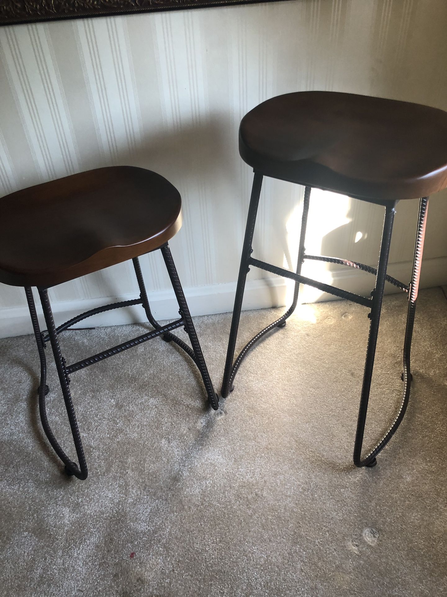 2 wood and rod iron bar stools