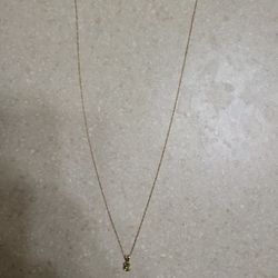 14 K Gold Necklace With 14 K Gold Pendant.  Weight Is 1 Gram