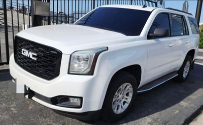 OEM GMC Yukon Wheels 18" with tires.