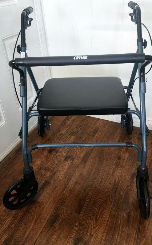 DRIVE MEDICAL WALKER: 19" SEAT WIDTH. BACK REST. FOLDABLE. EXCELLENT CONDITION!
