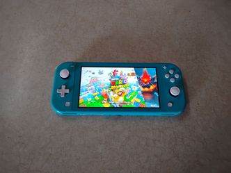 NINTENDO SWITCH LITE + 7500 GAMES INSTALLED