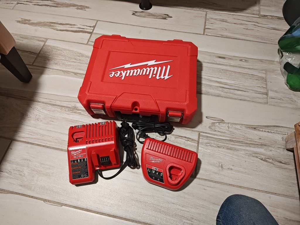 Milwaukee Battery Chargers And 1 Empty Drill Case