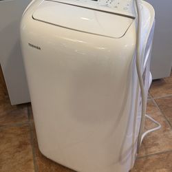 Toshiba 10,000 BTU Air Conditioner Unit.
