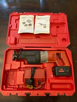 Milwaukee heavy duty cordless sawzall, charger, and case (defective battery)