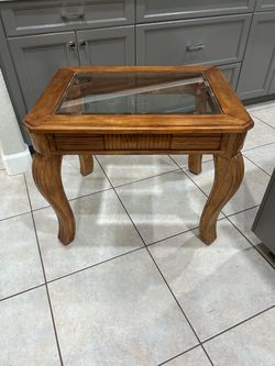 End table.. wood with glass top