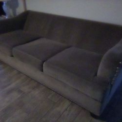 Grey upholstered couch in good condition. 87" wide