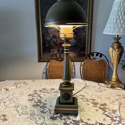 Antique tole lamp with a hurricane glass shade and a Round, tin Tin cover