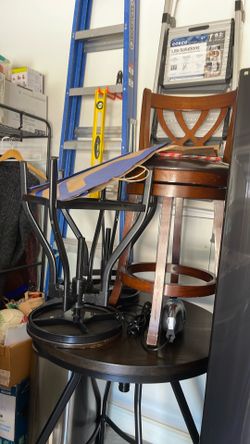 Bar table with four stools.