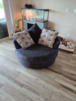 Loves seat and swivel chair with oversized pillows