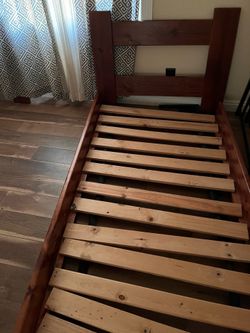 HARDWOOD TWIN BED WITH A MATTRESS  in a good condition