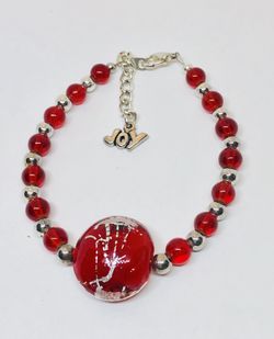 Bracelet in red and silver with art glass center piece and JOY charm