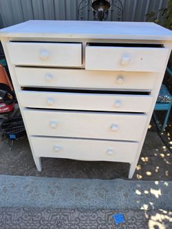 Antique white dresser
34"w x 20"d x 43.5"h 
Solid wood 
original hardware 
Sturdy drawers