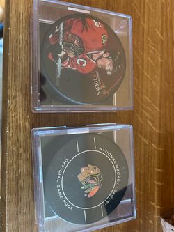 Jonathan Toews and Chicago Blackhawks NHL Hockey Pucks