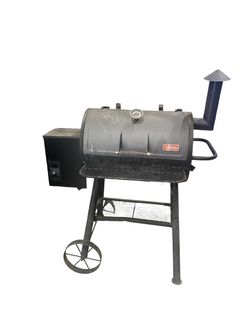 Outdoor Gourmet wood pellet grill and smoker BBQ outdoor party fun