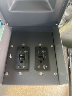 Outdoor electrical outlet box with 2 black GFCI receptacle